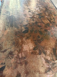 A Chinese rectangular carved and lacquered wooden low table with peach design, Qing