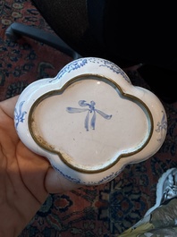 A Chinese Canton enamel bowl and cover, a patipan and a saucer with figures in a landscape, 19th C.