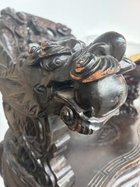 A pair of Japanese carved wooden 'dragon' chairs, Meiji, 19th/20th C.