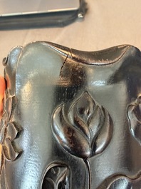 A Chinese ebonized wooden brush pot with relief design of lotus flowers and an inscription, 20th C.