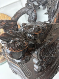 A pair of Japanese carved wooden 'dragon' chairs, Meiji, 19th/20th C.