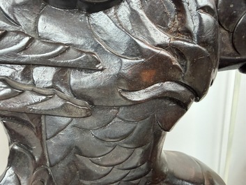 A pair of Japanese carved wooden 'dragon' chairs, Meiji, 19th/20th C.