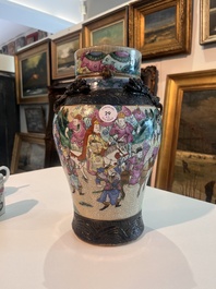 A Chinese Nanking crackle glazed famille rose 'warrior' vase and cover, a tea caddy and an Imari style teapot and cover, 18th/19th C.