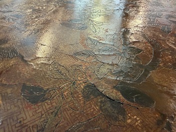 A Chinese rectangular carved and lacquered wooden low table with peach design, Qing
