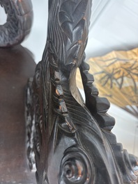 A pair of Japanese carved wooden 'dragon' chairs, Meiji, 19th/20th C.