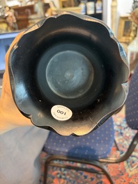 A Chinese ebonized wooden brush pot with relief design of lotus flowers and an inscription, 20th C.