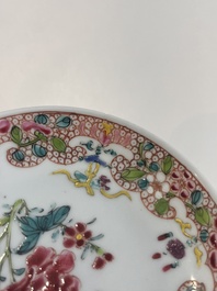 Six Chinese famille rose and gilt cups and saucers and a cream jug with floral and mandarin design, Yongzheng/Qianlong