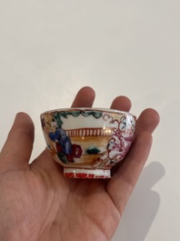 Six Chinese famille rose and gilt cups and saucers and a cream jug with floral and mandarin design, Yongzheng/Qianlong