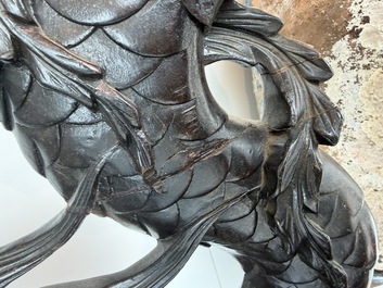 A pair of Japanese carved wooden 'dragon' chairs, Meiji, 19th/20th C.