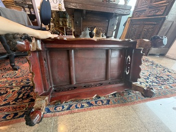 A Chinese rectangular carved and lacquered wooden low table with peach design, Qing