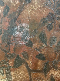 A Chinese rectangular carved and lacquered wooden low table with peach design, Qing