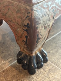 A Chinese rectangular carved and lacquered wooden low table with peach design, Qing
