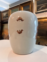 A pair of Chinese qianjiang cai jars and covers with ladies and children in a palace garden, 19th/20th C.