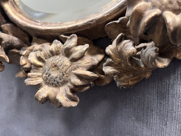 A pair of French gilt and carved wooden 'sunflower' mirrors, 18th C.