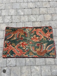 A Tibetan wool 'dragons and phoenixes' rug, 19th C.