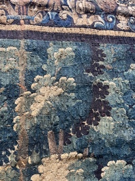 A Flemish wall tapestry with birds in a landscape with a castle in the background, 17th C.