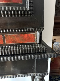 An ebonized wooden and tortoiseshell-veneered Antwerp cabinet on stand, 17th C. and later