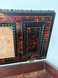 An ebonized wooden and tortoiseshell-veneered Antwerp cabinet on stand, 17th C. and later