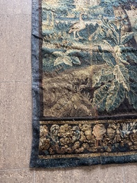 A Flemish wall tapestry with birds in a landscape with a castle in the background, 17th C.
