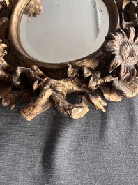 A pair of French gilt and carved wooden 'sunflower' mirrors, 18th C.