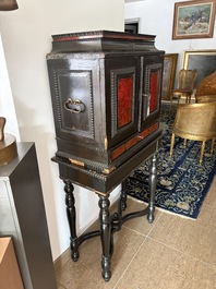An ebonized wooden and tortoiseshell-veneered Antwerp cabinet on stand, 17th C. and later