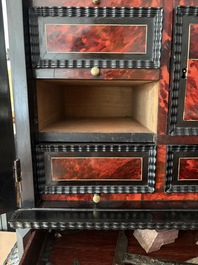 An ebonized wooden and tortoiseshell-veneered Antwerp cabinet on stand, 17th C. and later