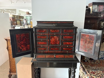 An ebonized wooden and tortoiseshell-veneered Antwerp cabinet on stand, 17th C. and later
