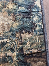 A Flemish wall tapestry with birds in a landscape with a castle in the background, 17th C.