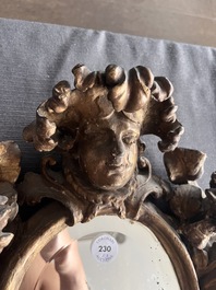 A pair of French gilt and carved wooden 'sunflower' mirrors, 18th C.