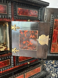An ebonized wooden and tortoiseshell-veneered Antwerp cabinet on stand, 17th C. and later