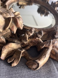 A pair of French gilt and carved wooden 'sunflower' mirrors, 18th C.