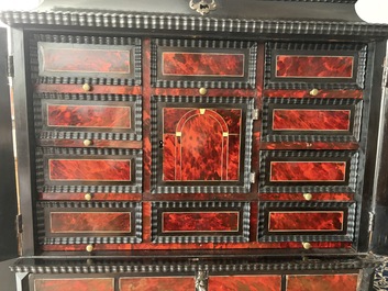 An ebonized wooden and tortoiseshell-veneered Antwerp cabinet on stand, 17th C. and later