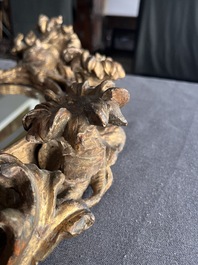 A pair of French gilt and carved wooden 'sunflower' mirrors, 18th C.