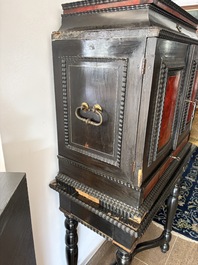 An ebonized wooden and tortoiseshell-veneered Antwerp cabinet on stand, 17th C. and later