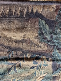 A Flemish wall tapestry with birds in a landscape with a castle in the background, 17th C.