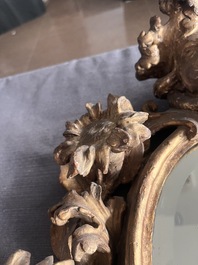 A pair of French gilt and carved wooden 'sunflower' mirrors, 18th C.