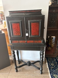 An ebonized wooden and tortoiseshell-veneered Antwerp cabinet on stand, 17th C. and later