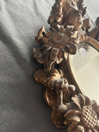 A pair of French gilt and carved wooden 'sunflower' mirrors, 18th C.