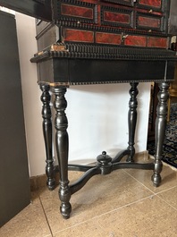 An ebonized wooden and tortoiseshell-veneered Antwerp cabinet on stand, 17th C. and later