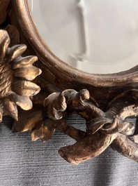 A pair of French gilt and carved wooden 'sunflower' mirrors, 18th C.