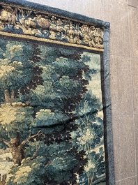 A Flemish wall tapestry with birds in a landscape with a castle in the background, 17th C.