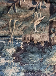 A Flemish wall tapestry with birds in a landscape with a castle in the background, 17th C.