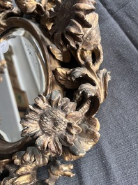 A pair of French gilt and carved wooden 'sunflower' mirrors, 18th C.