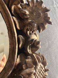 A pair of French gilt and carved wooden 'sunflower' mirrors, 18th C.