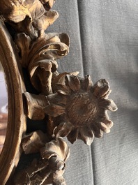 A pair of French gilt and carved wooden 'sunflower' mirrors, 18th C.