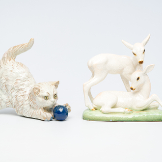 J. Filmont (second quarter 20th C.): A playing cat and a 'deer' group in polychrome decorated porcelain, Goldscheider, 20th C.