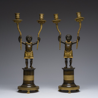 A pair of French Directoire ormolu and patinated bronze two-light candelabra in the form of standing blackamoors, late 18th C.