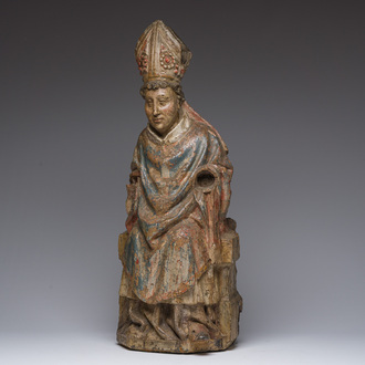 A Flemish polychromed wooden sculpture of a bishop, possibly Saint Nicholas, 16th C.