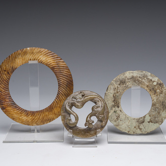Three jade and/or hardstone discs or bracelets, China and Thailand, probably Jin Dynasty and later