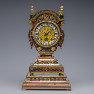 A French 'tête de poupée' gilt bronze mounted tortoiseshell, brass and pewter marquetry Louis XIV Boulle mantel clock on stand, late 17th C.
